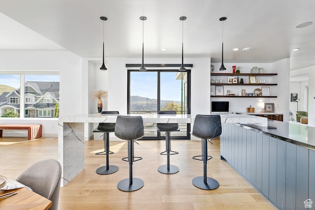 1620 W Brevia Ct Unit 25, Lehi, UT 84043 - kitchen featuring light wood-type flooring, open shelves, pendant lighting, stone counters, and recessed lighting