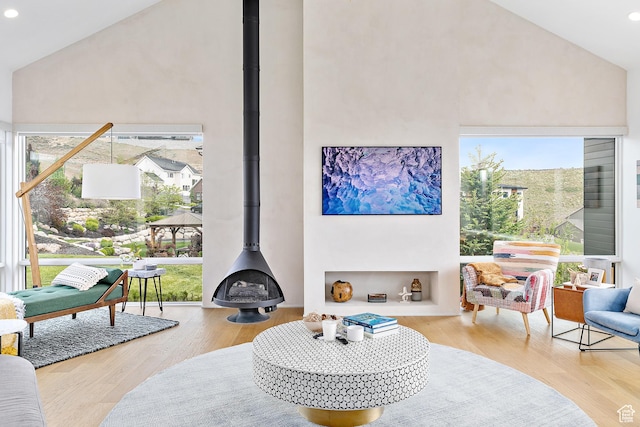 1620 W Brevia Ct Unit 25, Lehi, UT 84043 - living room featuring a wood stove, high vaulted ceiling, healthy amount of natural light, wood finished floors, and recessed lighting