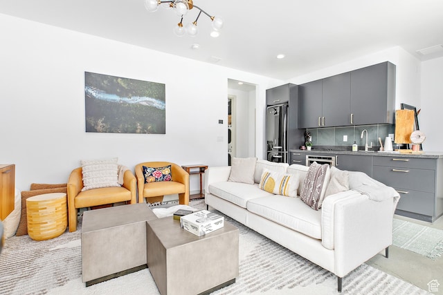 1620 W Brevia Ct Unit 25, Lehi, UT 84043 - living area featuring bar with sink, a chandelier, and recessed lighting