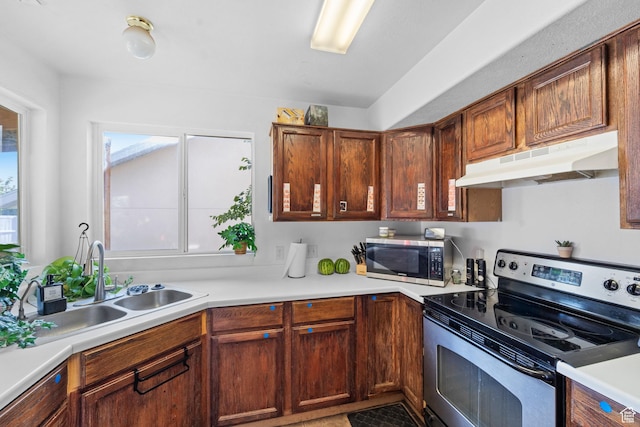 444 E 670 N, Tooele, UT 84074 - kitchen with stainless steel appliances, under cabinet range hood, plenty of natural light, and a sink