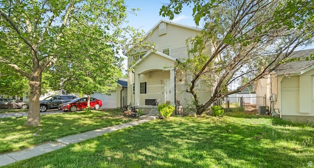444 E 670 N, Tooele, UT 84074 - view of front of house with stucco siding, central AC, and an attached garage
