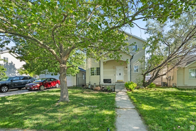 444 E 670 N, Tooele, UT 84074 - obstructed view of property featuring a front lawn, a garage, and central AC unit