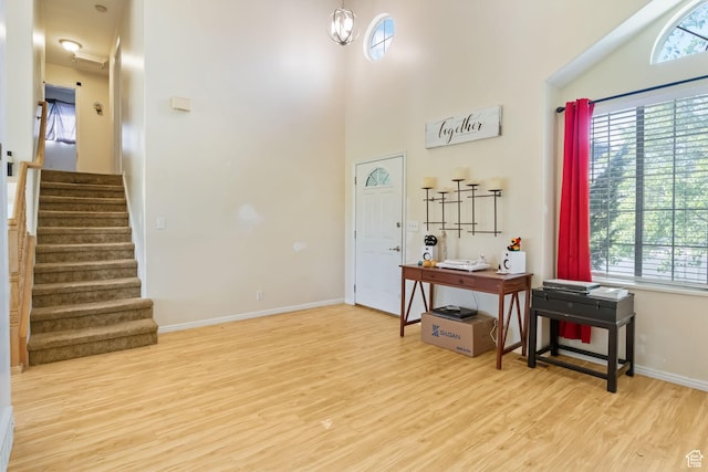1367 E 3125 N, Layton, UT 84040 - foyer featuring light wood-type flooring, stairs, a high ceiling, and baseboards