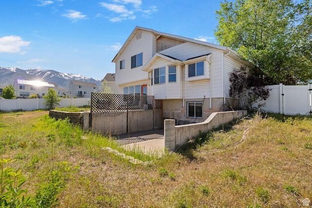 1367 E 3125 N, Layton, UT 84040 - back of property featuring a fenced backyard and a mountain view