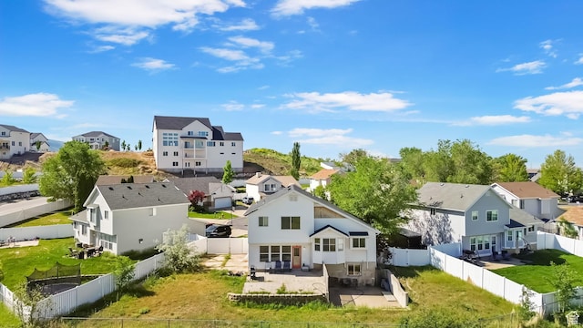1367 E 3125 N, Layton, UT 84040 - back of property featuring a residential view, a patio, and a fenced backyard
