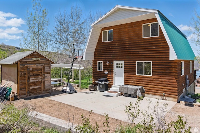 10246 E Lake Pines Dr Unit 1020, Heber City, UT 84032 - rear view of house featuring a gambrel roof, a patio area, entry steps, and log siding