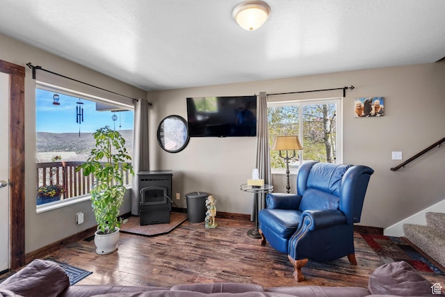 10246 E Lake Pines Dr Unit 1020, Heber City, UT 84032 - living room featuring stairway, wood finished floors, baseboards, and a wood stove