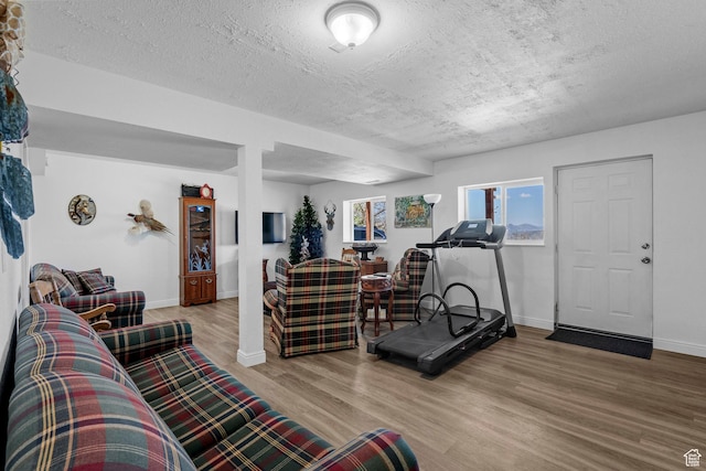 10246 E Lake Pines Dr Unit 1020, Heber City, UT 84032 - living area with wood finished floors, a textured ceiling, and baseboards