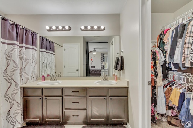 3864 E Cascade Rd, Eagle Mountain, UT 84005 - full bathroom with double vanity, ceiling fan, and a walk in closet