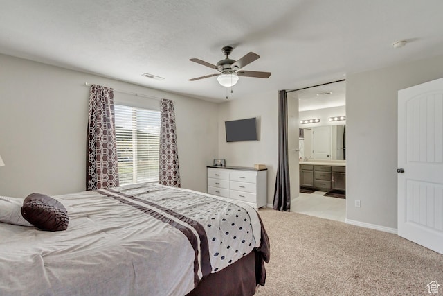 3864 E Cascade Rd, Eagle Mountain, UT 84005 - bedroom with light carpet, ensuite bathroom, a ceiling fan, and baseboards