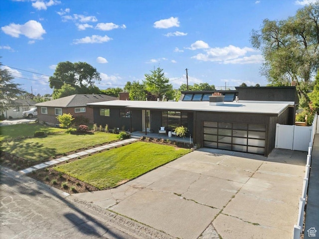 2559 E Evening Star Dr, Holladay, UT 84124 - view of front of house with an attached garage and concrete driveway