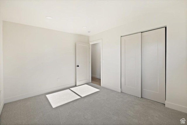 2559 E Evening Star Dr, Holladay, UT 84124 - unfurnished bedroom with carpet, baseboards, and a closet
