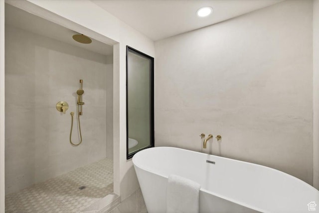2559 E Evening Star Dr, Holladay, UT 84124 - bathroom featuring a tile shower, a freestanding bath, and recessed lighting
