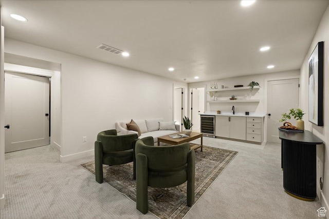 2559 E Evening Star Dr, Holladay, UT 84124 - living room with bar with sink, light carpet, recessed lighting, wine cooler, and baseboards