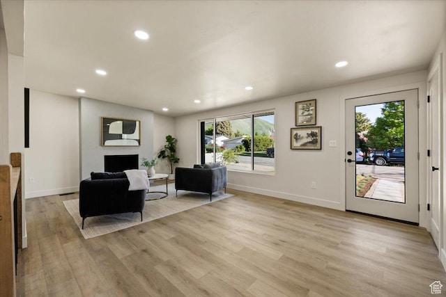 2559 E Evening Star Dr, Holladay, UT 84124 - living area featuring plenty of natural light, light wood finished floors, recessed lighting, and baseboards