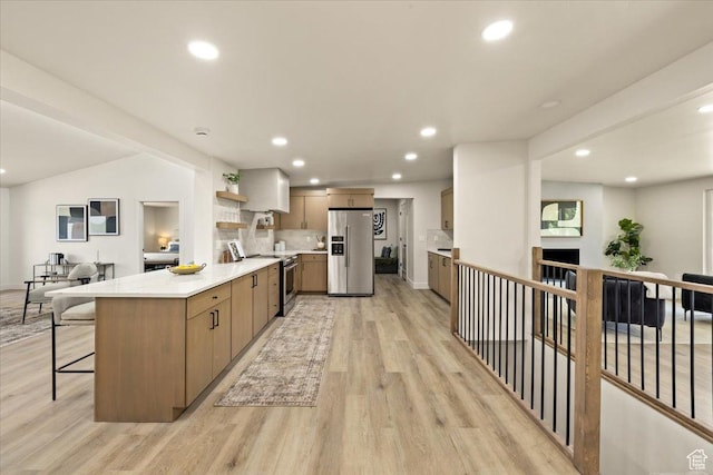 2559 E Evening Star Dr, Holladay, UT 84124 - kitchen with appliances with stainless steel finishes, a peninsula, light wood-type flooring, open shelves, and recessed lighting