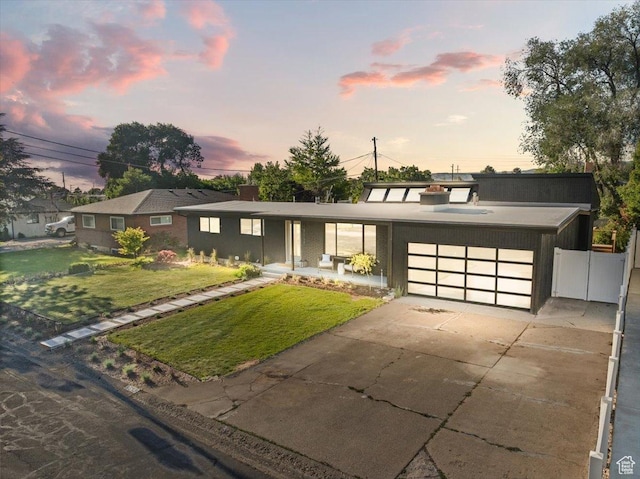 2559 E Evening Star Dr, Holladay, UT 84124 - view of front of home featuring an attached garage and driveway
