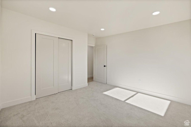 2559 E Evening Star Dr, Holladay, UT 84124 - unfurnished bedroom with light colored carpet, recessed lighting, a closet, and baseboards