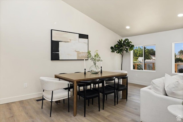 2559 E Evening Star Dr, Holladay, UT 84124 - dining space with light wood finished floors, baseboards, lofted ceiling, and recessed lighting