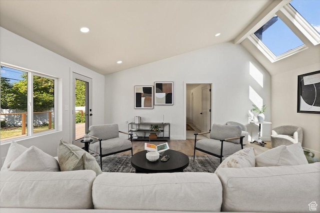2559 E Evening Star Dr, Holladay, UT 84124 - living room featuring a skylight, vaulted ceiling, wood finished floors, recessed lighting, and baseboards