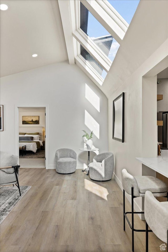 2559 E Evening Star Dr, Holladay, UT 84124 - living room with a skylight, lofted ceiling, baseboards, wood finished floors, and recessed lighting