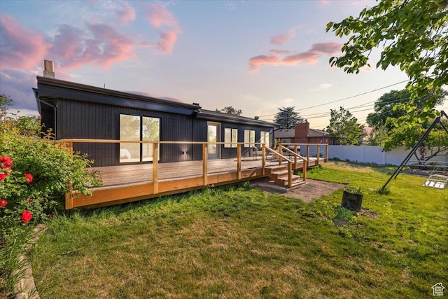 2559 E Evening Star Dr, Holladay, UT 84124 - back of house at dusk featuring a wooden deck