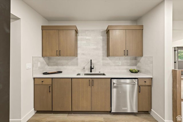 2559 E Evening Star Dr, Holladay, UT 84124 - kitchen featuring a sink, stainless steel dishwasher, light countertops, and backsplash