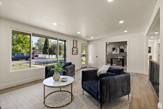 2559 E Evening Star Dr, Holladay, UT 84124 - living area with light wood finished floors, plenty of natural light, recessed lighting, and baseboards