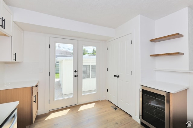 4673 W 5255 S, Kearns, UT 84118 - entryway with wine cooler and light wood-style flooring