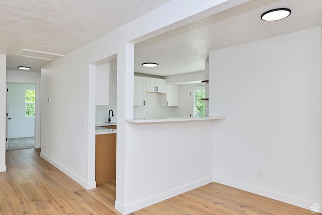4673 W 5255 S, Kearns, UT 84118 - hallway with baseboards and light wood-style flooring