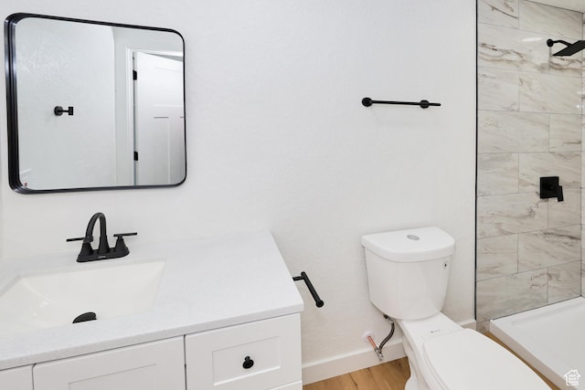4673 W 5255 S, Kearns, UT 84118 - full bath with toilet, vanity, a tile shower, baseboards, and wood finished floors