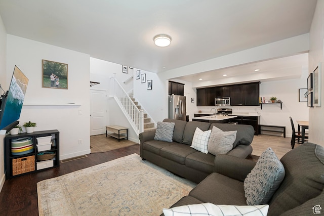 841 W Cannara Way S, Midvale, UT 84047 - living room with stairway, baseboards, wood finished floors, and recessed lighting