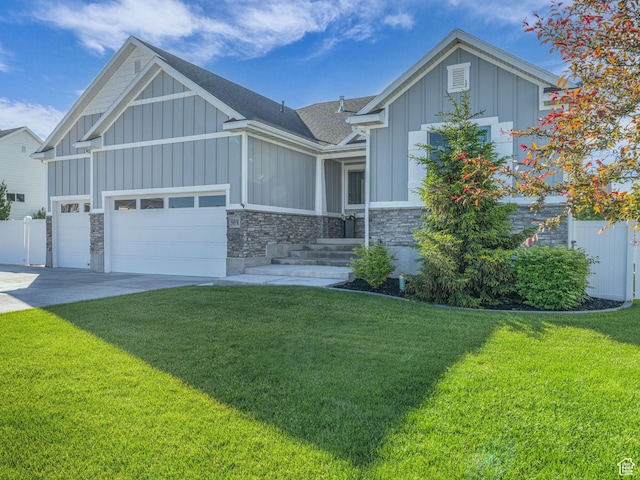 1949 W Shadow Way, Kaysville, UT 84037 - view of front of property featuring board and batten siding, stone siding, an attached garage, concrete driveway, and roof with shingles