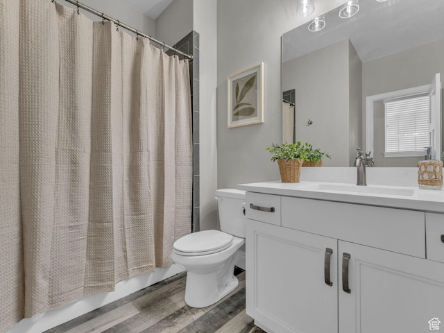 1949 W Shadow Way, Kaysville, UT 84037 - bathroom featuring vanity, toilet, wood finished floors, and shower / bath combination with curtain