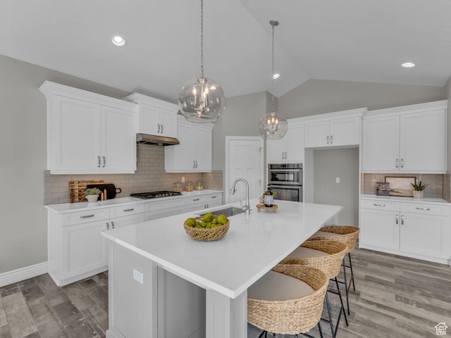 1949 W Shadow Way, Kaysville, UT 84037 - kitchen with a sink, under cabinet range hood, gas stovetop, light wood finished floors, and vaulted ceiling