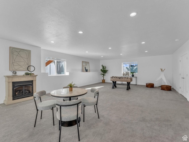 1949 W Shadow Way, Kaysville, UT 84037 - dining room with recessed lighting, a glass covered fireplace, light colored carpet, and baseboards