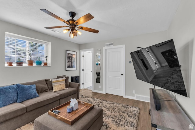6169 Longmore Dr, Salt Lake City, UT 84118 - living room featuring wood finished floors, a ceiling fan, and baseboards