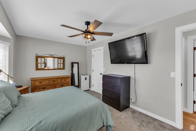 6169 Longmore Dr, Salt Lake City, UT 84118 - bedroom featuring baseboards, ceiling fan, and light colored carpet