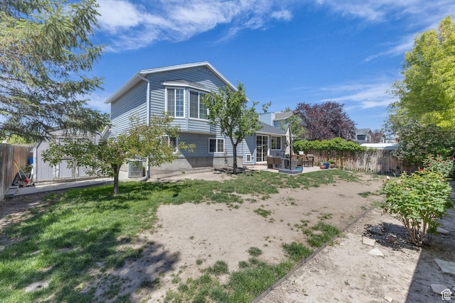 6169 Longmore Dr, Salt Lake City, UT 84118 - back of house with a patio and a fenced backyard