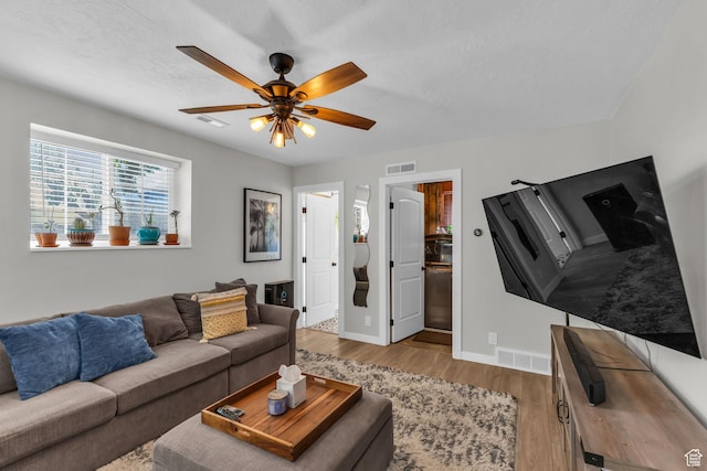 6169 Longmore Dr, Salt Lake City, UT 84118 - living room featuring wood finished floors, ceiling fan, baseboards, and a textured ceiling