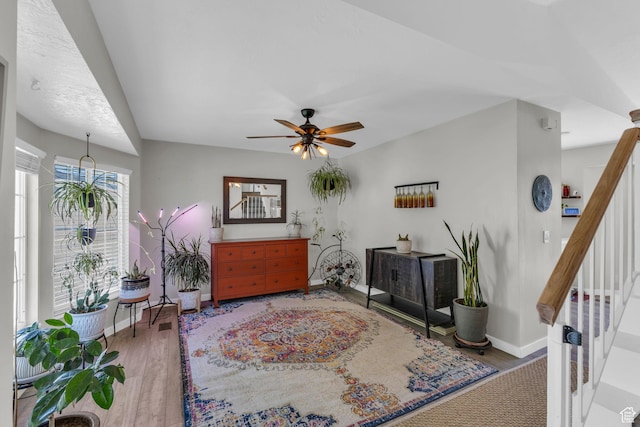 6169 Longmore Dr, Salt Lake City, UT 84118 - sitting room with stairway, baseboards, wood finished floors, and ceiling fan