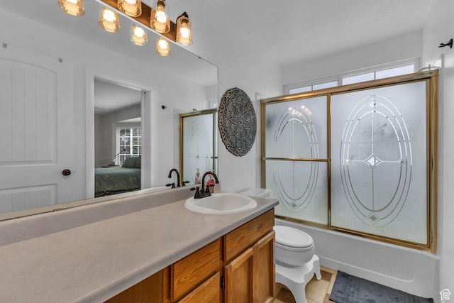 6169 Longmore Dr, Salt Lake City, UT 84118 - ensuite bathroom featuring vanity, bath / shower combo with glass door, toilet, and tile patterned floors