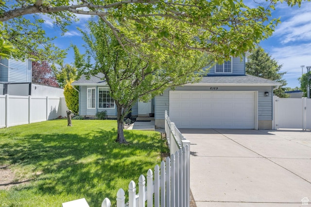 6169 Longmore Dr, Salt Lake City, UT 84118 - view of property hidden behind natural elements featuring concrete driveway and an attached garage