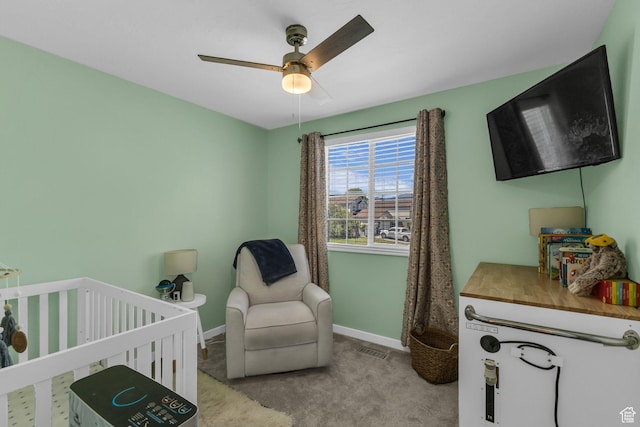 6169 Longmore Dr, Salt Lake City, UT 84118 - bedroom with carpet floors, baseboards, a nursery area, and a ceiling fan