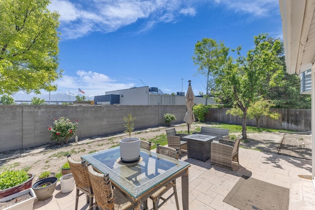6169 Longmore Dr, Salt Lake City, UT 84118 - fenced backyard featuring a patio area and outdoor dining area