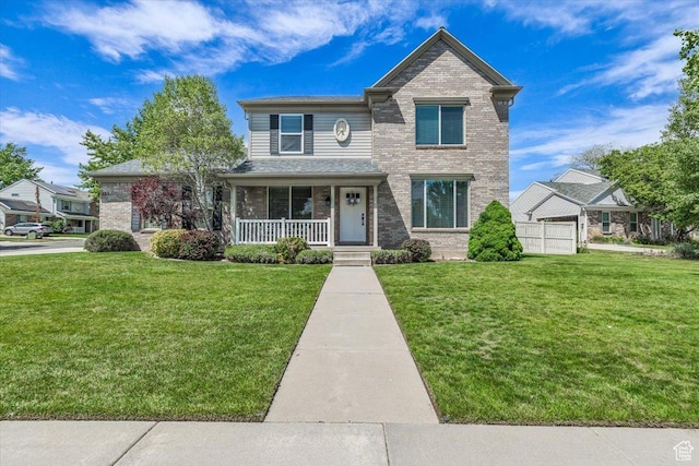 441 E Crape Myrtle Cir, Draper, UT 84020 - traditional home featuring covered porch, a front lawn, and brick siding