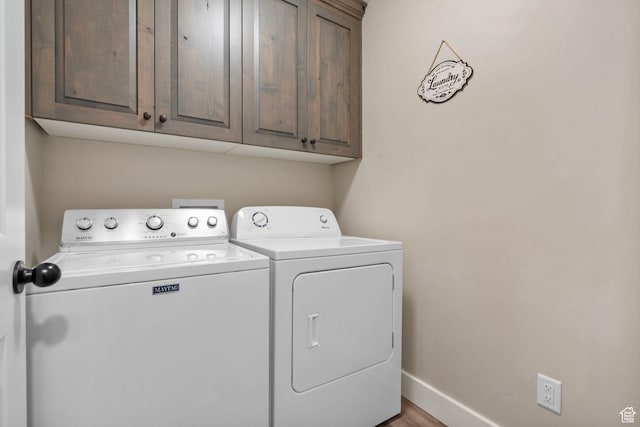 641 E Green Springs Way Unit 324, South Weber, UT 84405 - laundry area with cabinet space, independent washer and dryer, baseboards, and wood finished floors