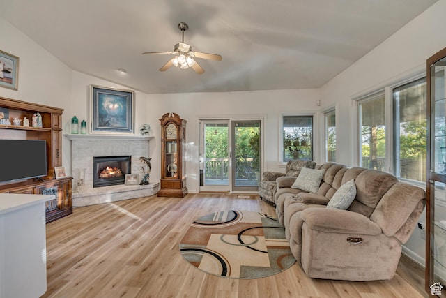 3286 N Piute Dr, Provo, UT 84604 - living area with a stone fireplace, ceiling fan, lofted ceiling, and light wood-type flooring