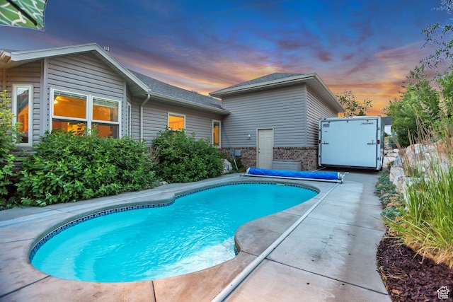 3286 N Piute Dr, Provo, UT 84604 - pool at dusk with a patio