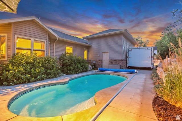 3286 N Piute Dr, Provo, UT 84604 - pool at dusk featuring a patio